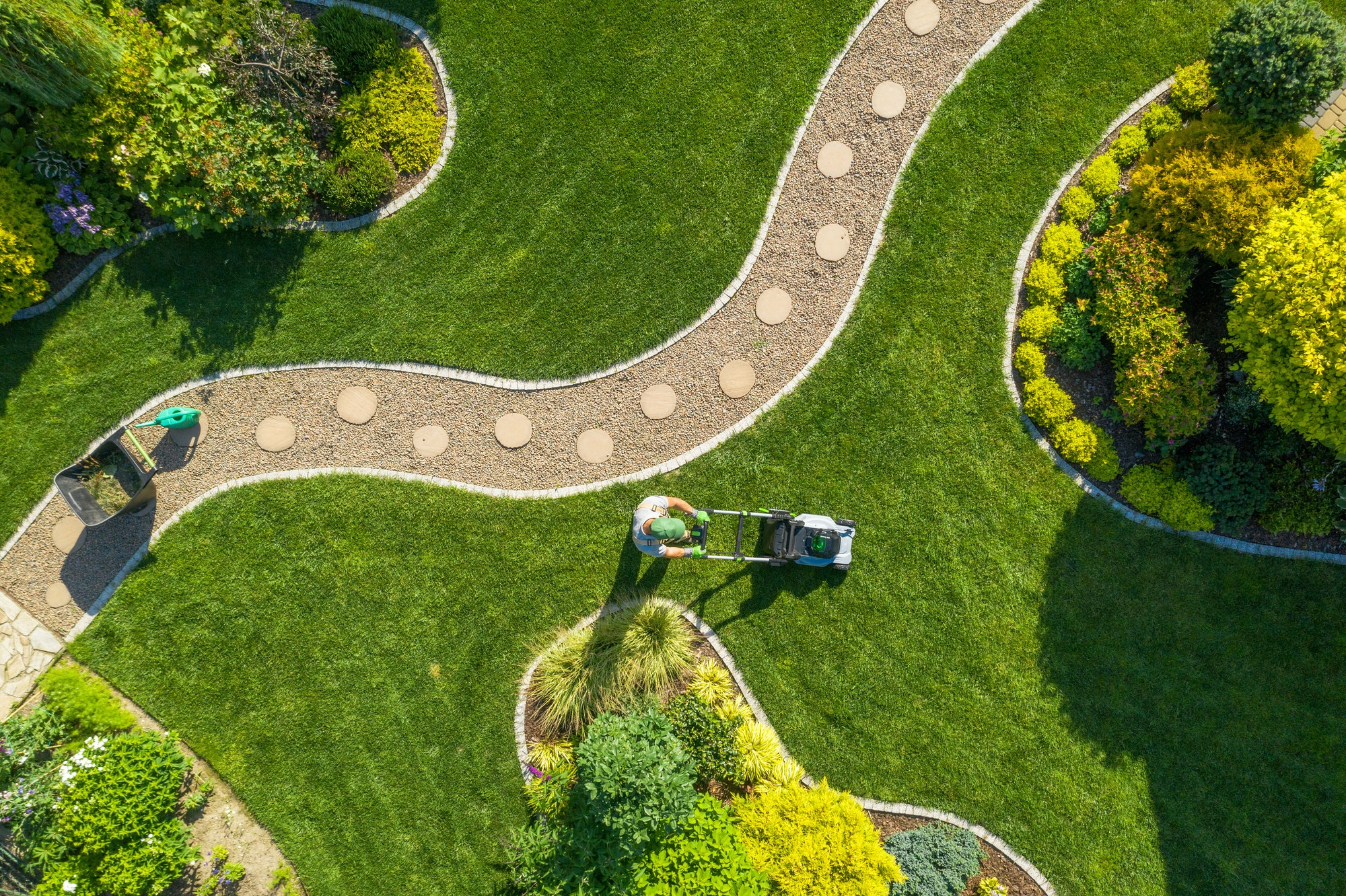 big-garden-grass-field-mowing-by-caucasian-gardener.jpg